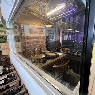 a view of a wine shop through a window