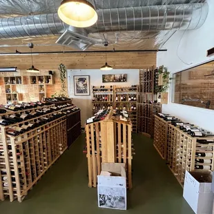 rows of wine bottles in a wine shop