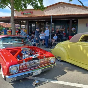 classic cars parked in front of the restaurant