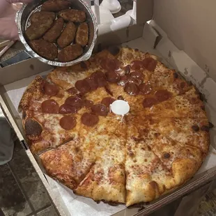 Half cheese, half pepperoni jumbo pizza (12 slices) with jalapeño poppers