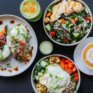 Kale chicken salad, Rise and Shine salad, green lovers juice, wellness shot, bruschetta toast, and a coffee.