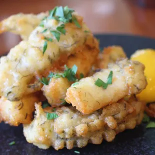 Calamari Fritti is deep-fried calamari battered with semolina, grana padano, and ogo seaweed.