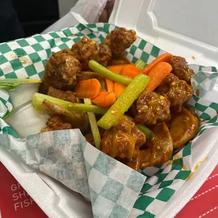 tray of chicken wings with carrots and celery