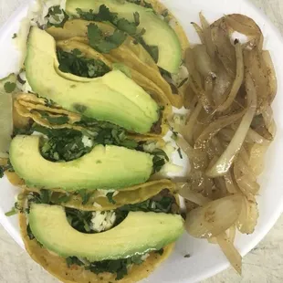 avocado and onions on a plate