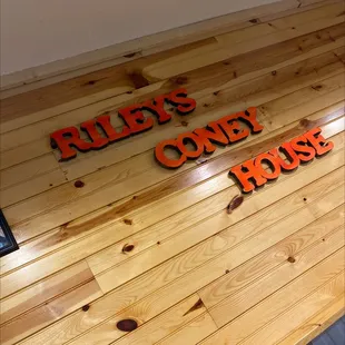 a wood floor and sign