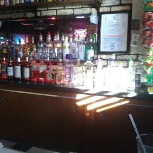 a bar with bottles of alcohol