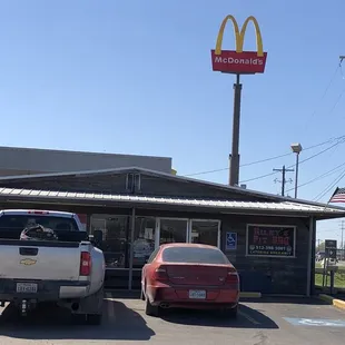 a truck parked in front of a restaurant