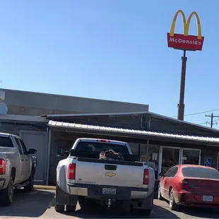 two trucks parked in front of a restaurant