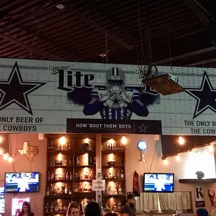 Dallas Cowboy banner on top of Bar...