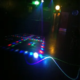 a dance floor with colored lights