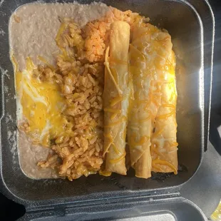 Lunch special, 3 taquitos with rice and beans.