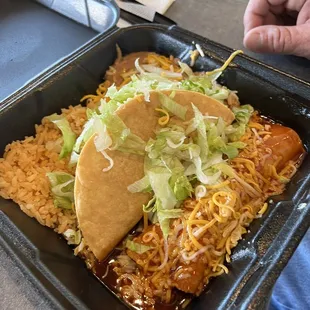 Ground beef enchilada and ground beef taco with rice and beans, delicious but meat is greasy! Great hangover food!