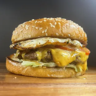a cheeseburger on a wooden table