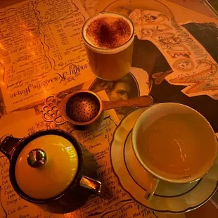 a cup of tea and a mug of coffee