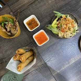 Pork skewers, spring rolls, &amp; papaya salad