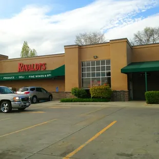 a parking lot with cars parked in front of it