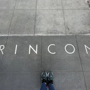 the word rincon on the sidewalk