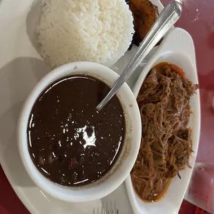 Ropa Vieja black beans plantains and white rice. Very good!