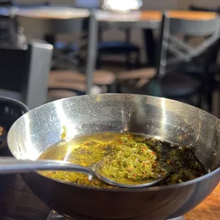 a bowl of soup with a spoon in it