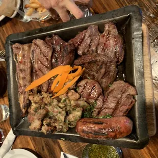 a platter of meat and vegetables