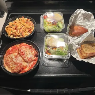 Take out order.  Chicken Parm, chicken penny pasta with vodka sauce, side, salads, and garlic bread.