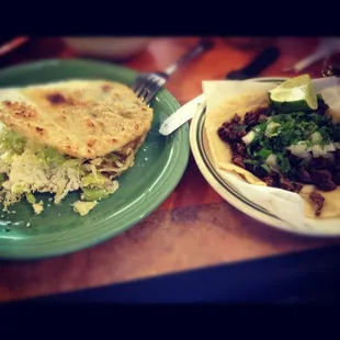 On the left I have a gordita de chicharron it was about $3 I had the green salsa one and it was spicy. On the right, a taco.