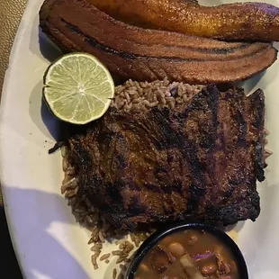 Carne Asada ,sweet plantains, black rice , side of beans