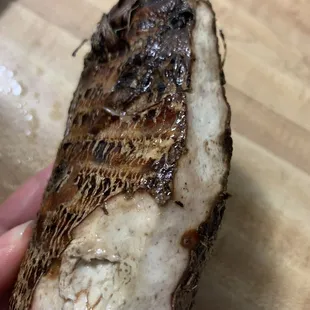 a piece of fish on a cutting board