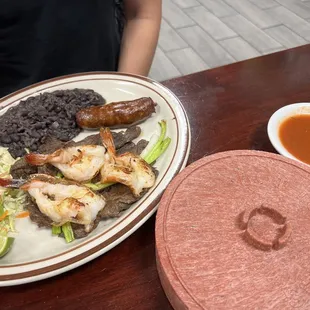 Churrasco Salvadoreño Grilled steak, 3 shrimp, sausage, mixed rice &amp; beans, and cabbage salad