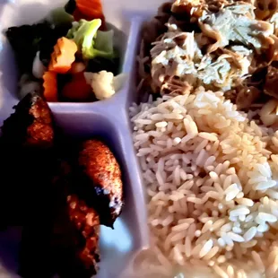 Dark pic of Pollo Guisado plate was nothing like the menu pic/description. Frozen vegetables, bones in the chicken. Big nope.