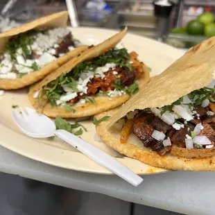 Gorditas , de Pastor (Marinated Pork) , Chicharrón, con queso fresco, cilantro y cebolla.