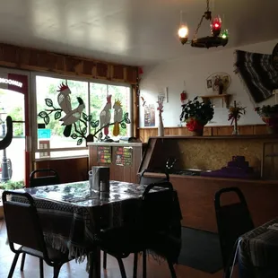 a dining room with a table and chairs