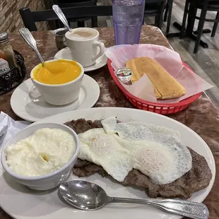 Café con leche. Pumpkin cream soup. Cuban toast. Steak and eggs with grits.