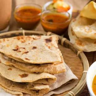 a plate of quesadillas and a bowl of soup