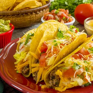 a plate of tacos and chips