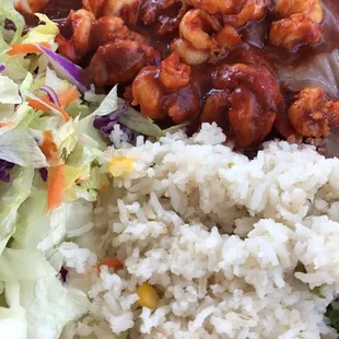 a plate of food with rice and vegetables