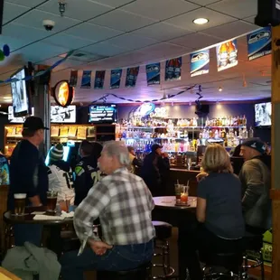 people sitting at the bar