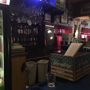 a bar with a beer cooler
