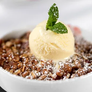 a bowl of food with a scoop of ice cream