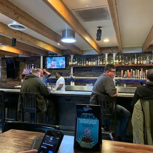 people sitting at a bar