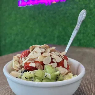 a bowl of fruit and nuts