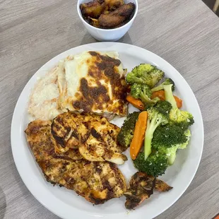 Grilled Chicken Breast with sides of plantains, chicken lasagna &amp; vegetables