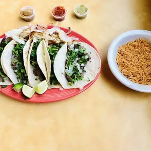 a plate of tacos and rice