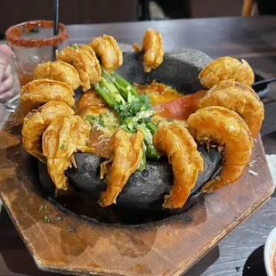 a large platter of fried shrimp