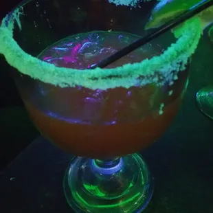 a margarita with a lime garnish