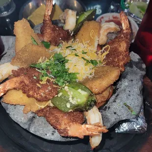 Seafood molcajete comes with fried fish, fried shrimp and peel xhrimp on the side