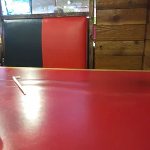 Black and Red upholstered booth with booth divider.