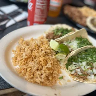 a plate of mexican food with rice and beans