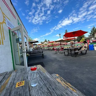 The picnic tables on asphalt