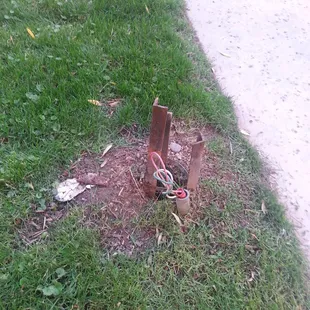 Rusted outlets and loose wires sticking out of the ground, check!